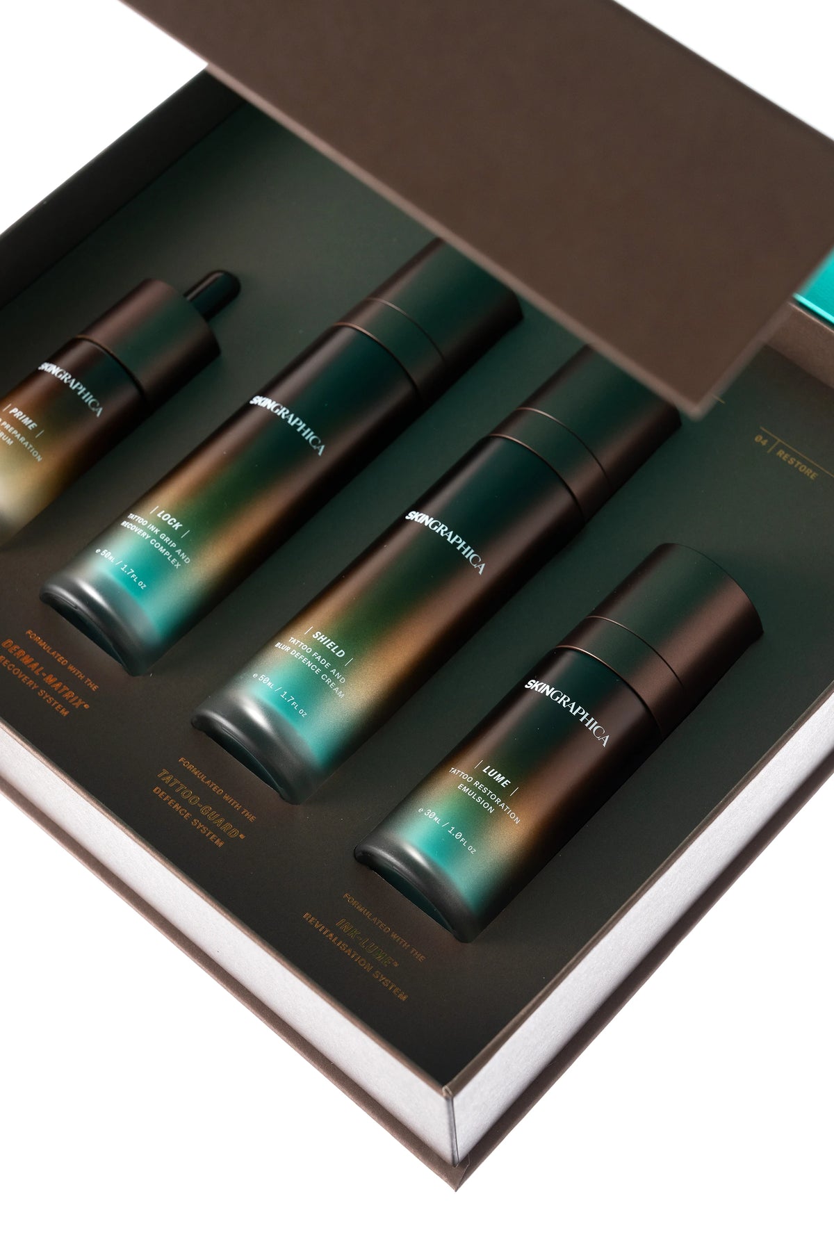 SKINGRAPHICA luxury tattoo skincare range with glow lighting