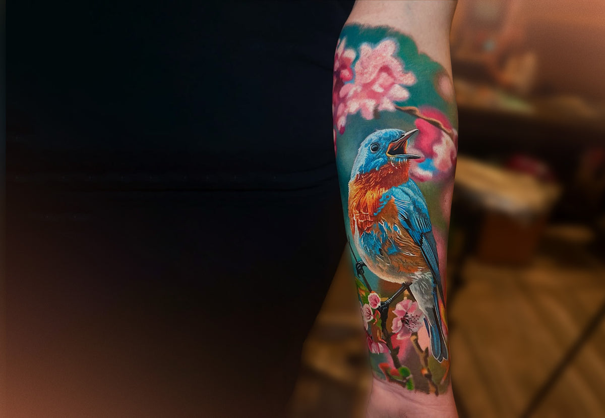 Realism bird tattoo on a forearm by Steve Butcher, Black Ivy Global Top 10