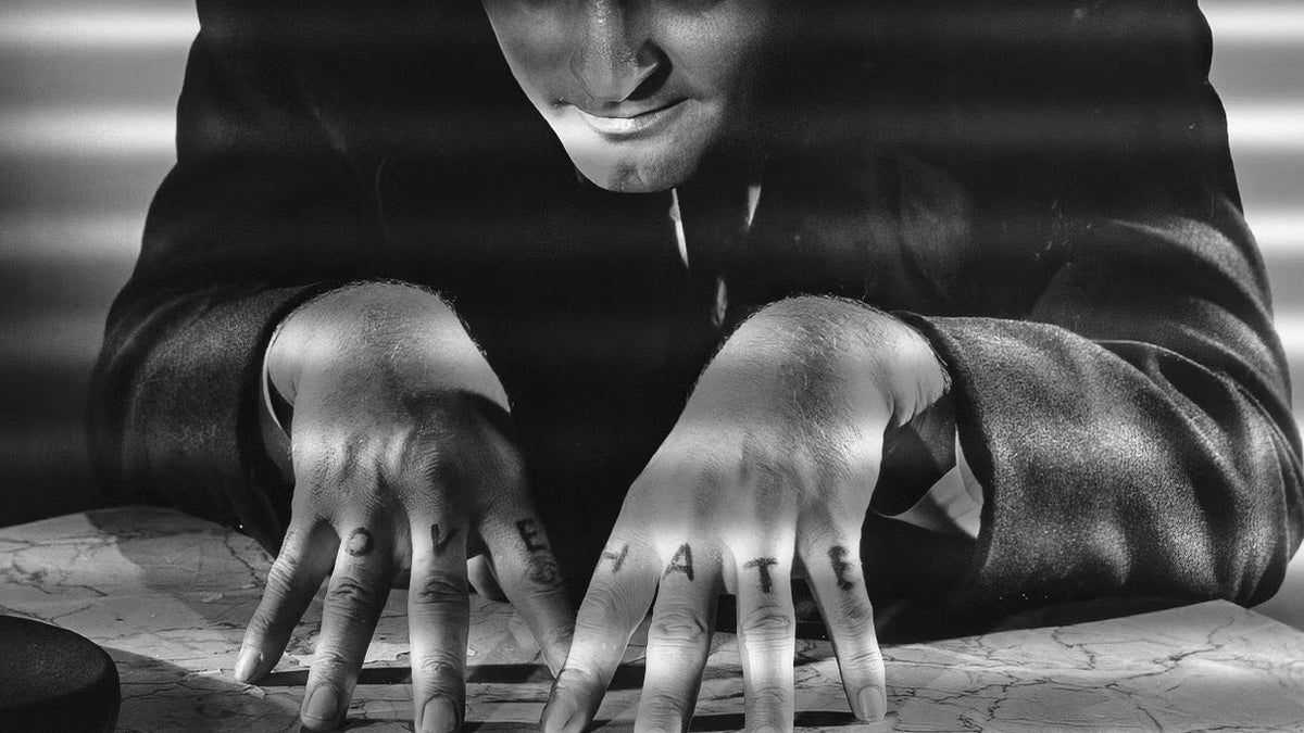 Hands tattooed with LOVE and HATE across the knuckles, the world’s most famous tattoos