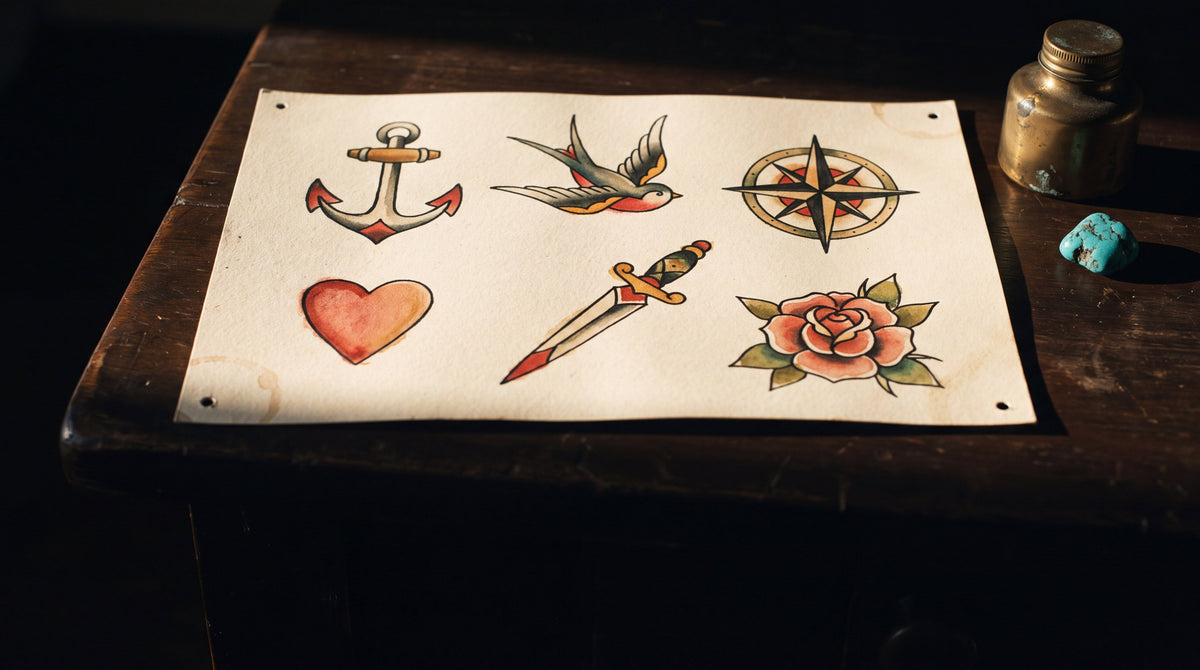 Hand drawn traditional tattoo flash of an anchor, swallow, compass, heart, dagger and rose, what tattoo symbols mean